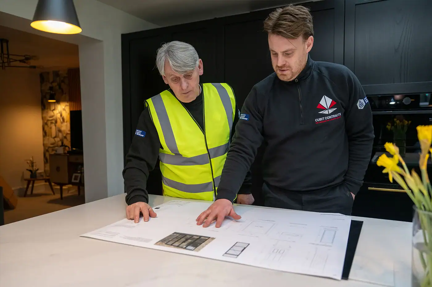 cubit contracts team looking over house extension drawings