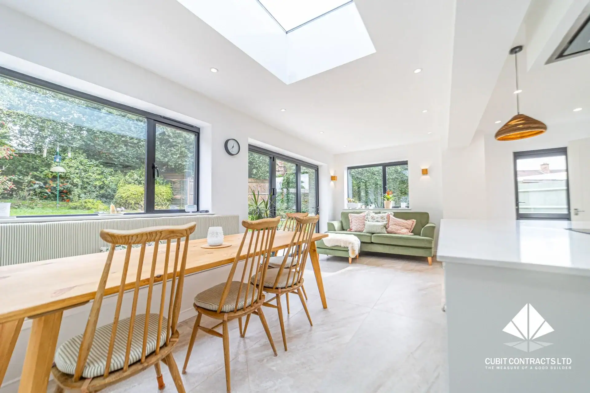 high end home renovation with modern kitchen and dining space