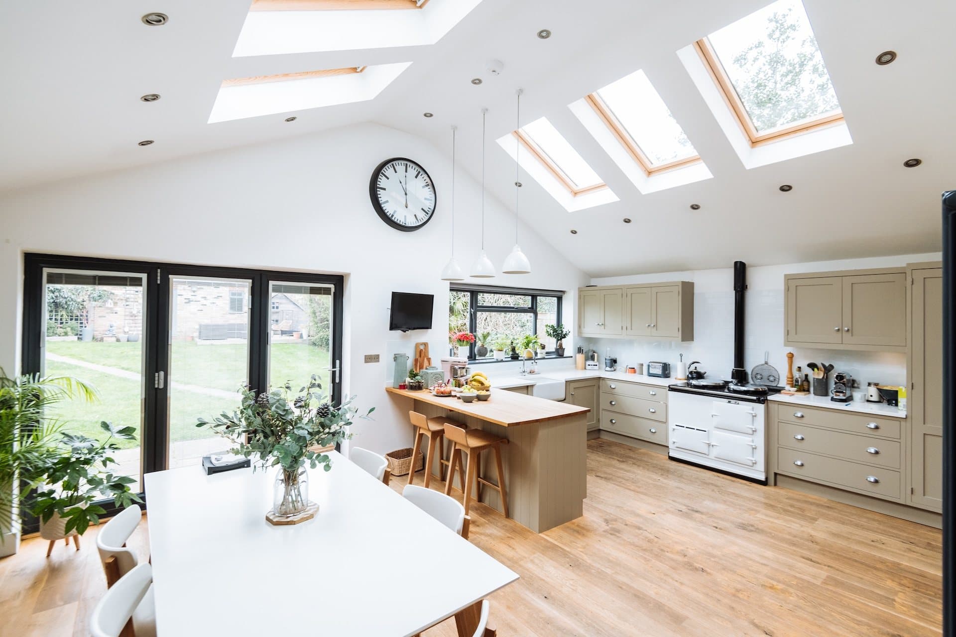 Vaulted kitchen diner house extension with rooflights and bi-fold doors